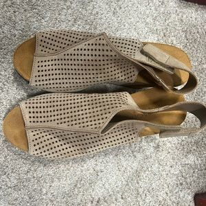 Tan wedge shoes will dress up any outfit